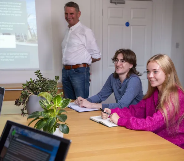 Zelst members talking in the boardroom.