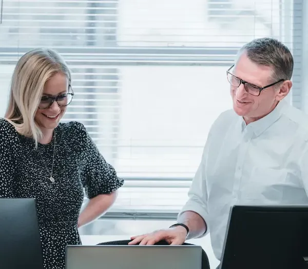 Two team members discussing importance of Mobile Friendly websites.