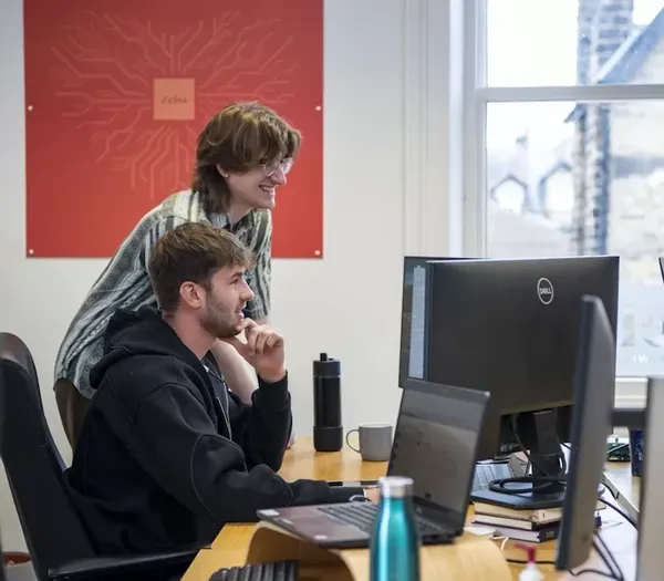 Two team members working in the office.