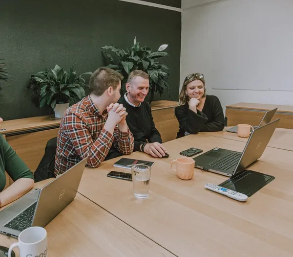 Meeting room with team members.