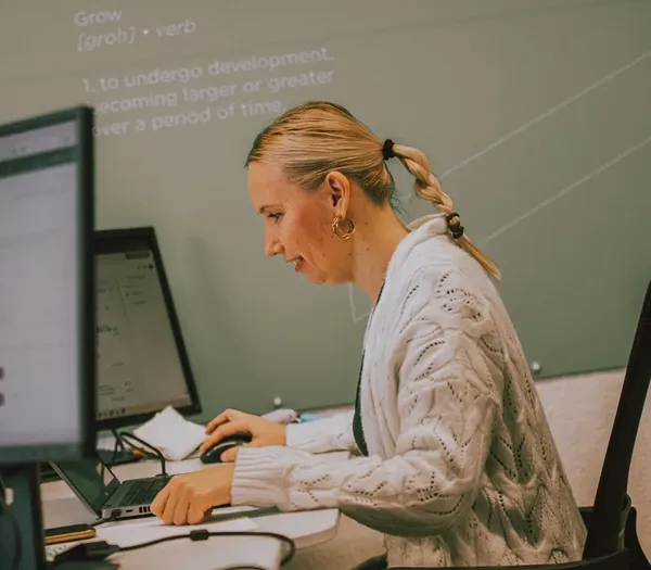 Zelst member working at her desk.