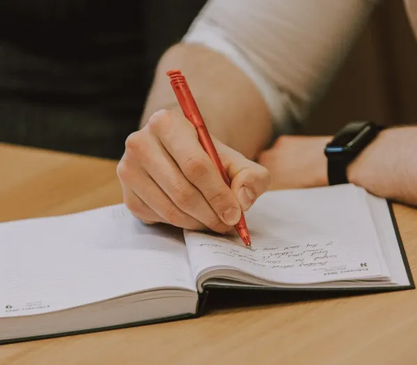 Zelst member taking notes.