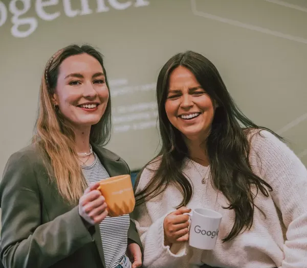 Two Zelst team members smiling.