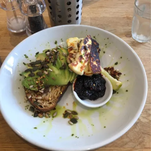 Avocado, halloumi and chili jam on sourdough at a cafe near brightonSEO.