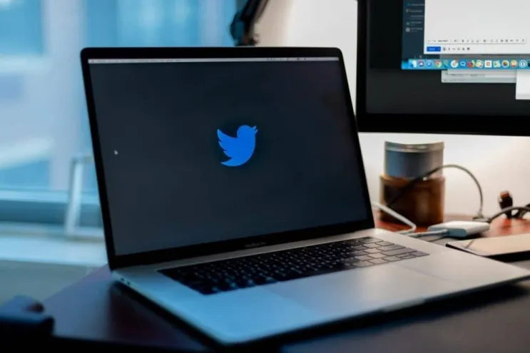 Twitter logo on laptop screen.