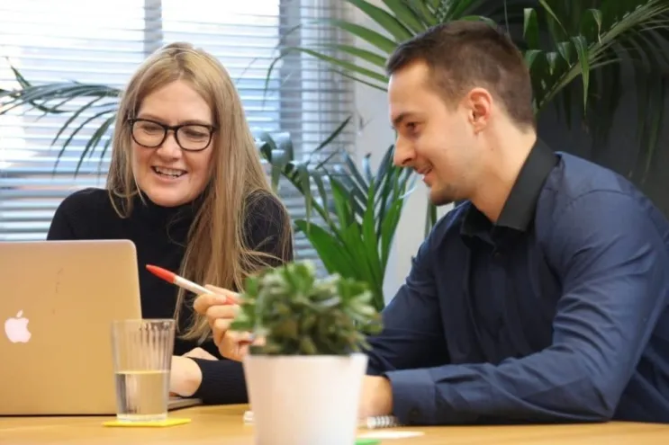 Two team members discussing what makes goof SEO.