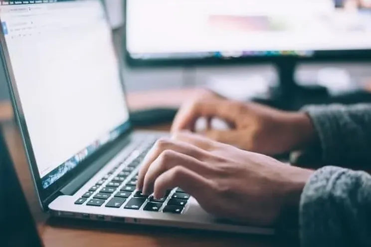 Man using social media on his laptop.